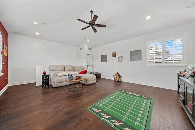 living room with dark wood-type flooring, ceiling fan, and lofted ceiling