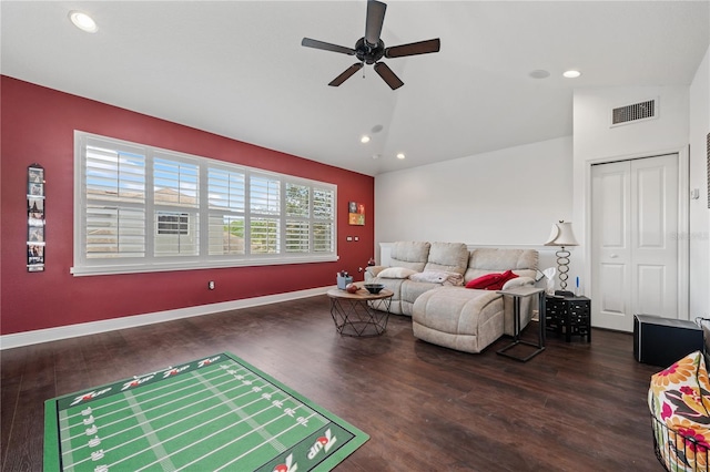 living room with vaulted ceiling, ceiling fan, and dark hardwood / wood-style flooring