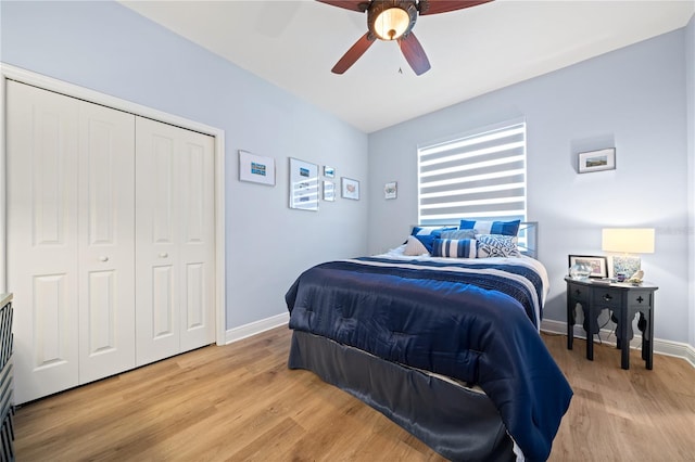 bedroom with a closet, ceiling fan, and light wood-type flooring