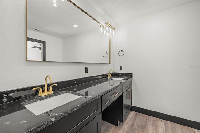 bathroom featuring vanity and hardwood / wood-style floors