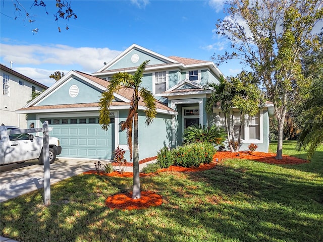 view of front of house featuring a garage and a front lawn