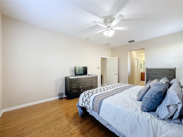 bedroom with wood-type flooring and ceiling fan