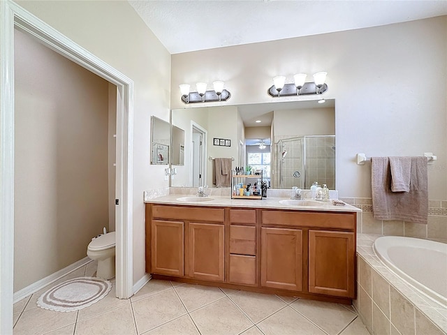 full bathroom with separate shower and tub, toilet, ceiling fan, vanity, and tile patterned flooring