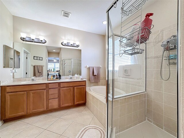 bathroom featuring vanity, ceiling fan, separate shower and tub, and tile patterned flooring