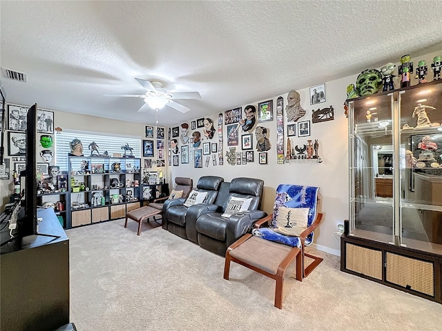 living room with light carpet, a textured ceiling, and ceiling fan