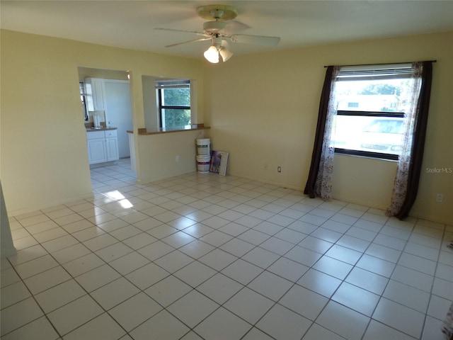 27242 Sunnybrook Rd Unit B, Punta Gorda, FL 33983 - empty room featuring a ceiling fan and light tile patterned floors