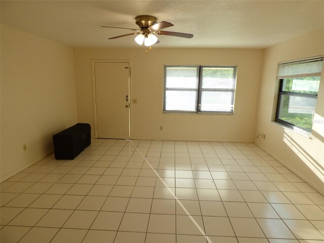27242 Sunnybrook Rd Unit B, Punta Gorda, FL 33983 - unfurnished room with a ceiling fan and light tile patterned floors