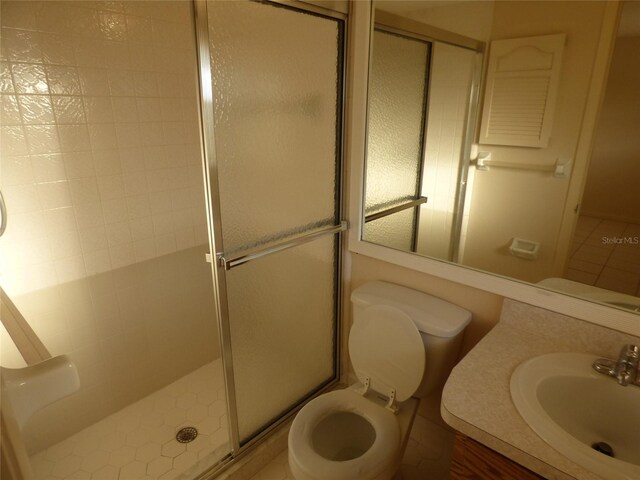 27242 Sunnybrook Rd Unit B, Punta Gorda, FL 33983 - bathroom featuring a shower stall, vanity, and toilet