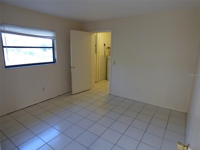 27242 Sunnybrook Rd Unit B, Punta Gorda, FL 33983 - spare room featuring light tile patterned floors and electric panel