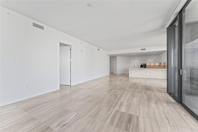 unfurnished living room featuring light hardwood / wood-style flooring