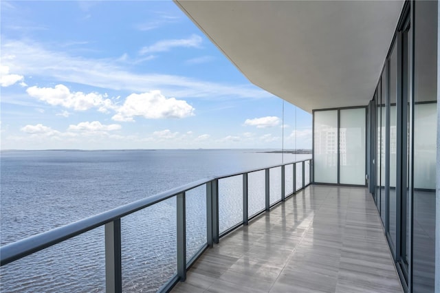 balcony featuring a water view