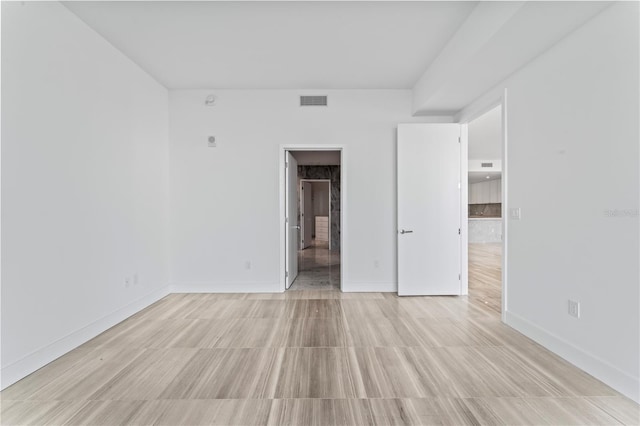 spare room with light wood-type flooring