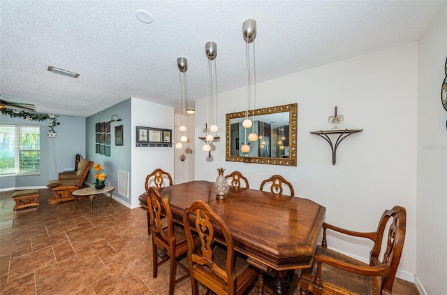 dining area with a textured ceiling