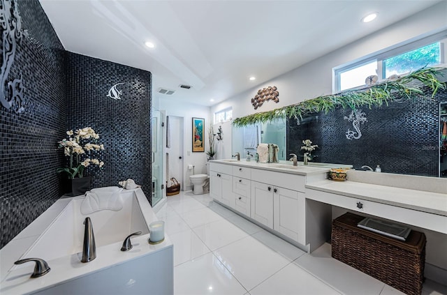 full bathroom featuring tile patterned flooring, vanity, toilet, and plus walk in shower