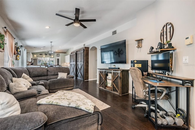 living room with wood-type flooring and ceiling fan