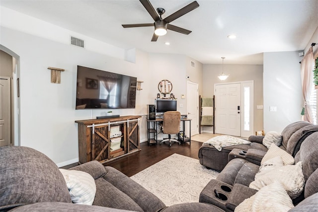 living room featuring lofted ceiling, dark wood-type flooring, and ceiling fan