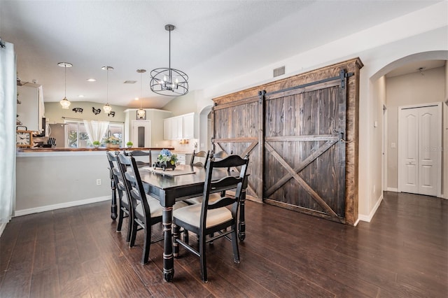 dining space with an inviting chandelier and dark hardwood / wood-style floors