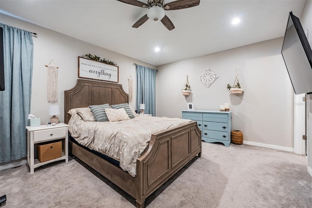 bedroom with light carpet and ceiling fan