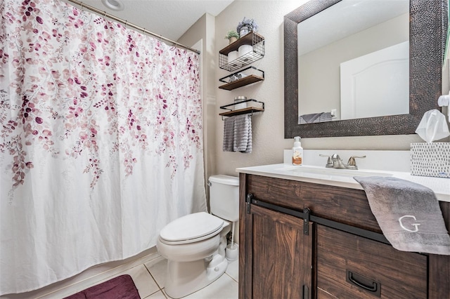 bathroom with vanity, curtained shower, toilet, and tile patterned flooring