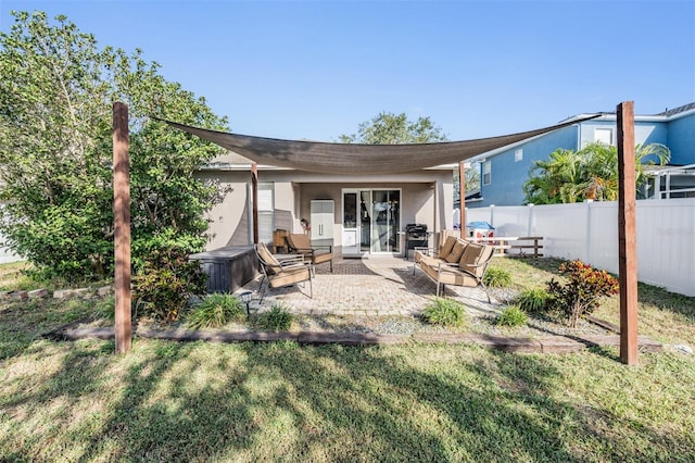 rear view of house with a patio area, an outdoor hangout area, and a lawn