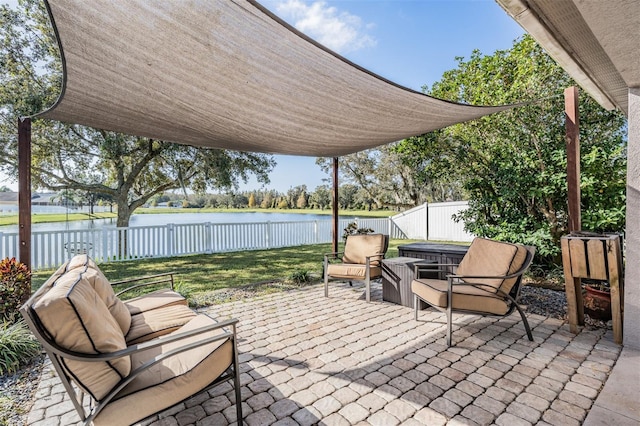 view of patio with a water view and an outdoor hangout area