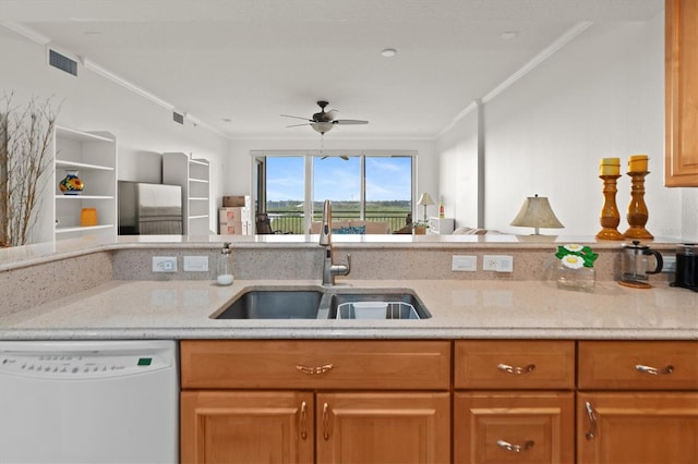 kitchen featuring dishwasher, ceiling fan, ornamental molding, and sink