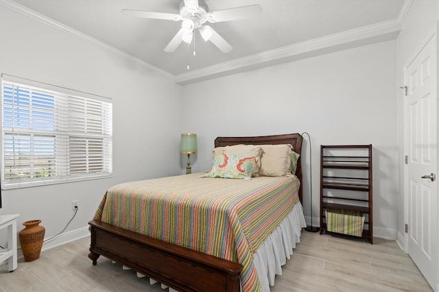 bedroom with ceiling fan, light wood-type flooring, and ornamental molding