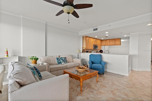 living room with ceiling fan, light tile patterned flooring, and ornamental molding