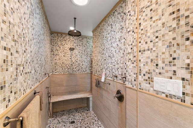 bathroom with tile walls and walk in shower