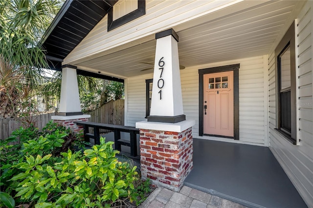 view of exterior entry featuring a porch