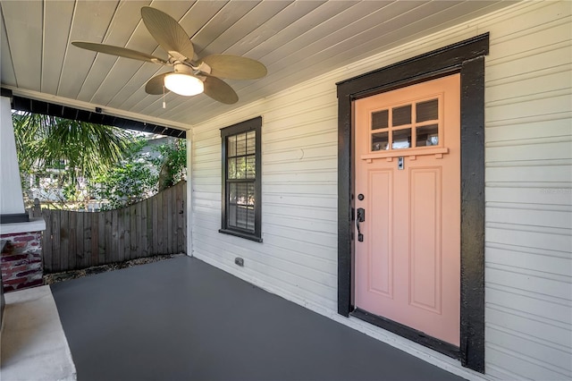 view of exterior entry with ceiling fan