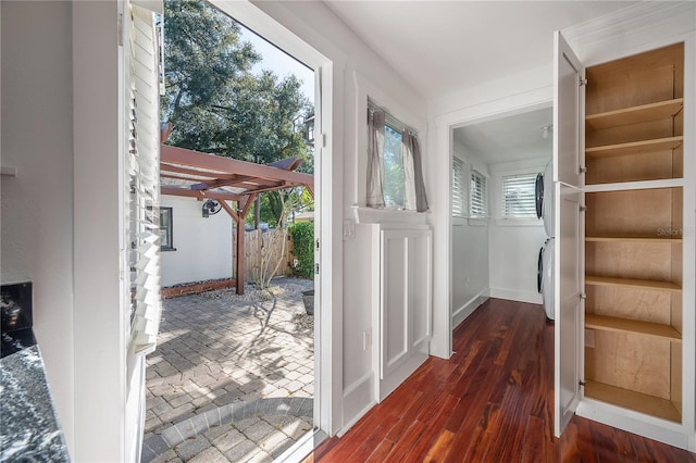 entryway featuring washer / clothes dryer and dark wood-type flooring