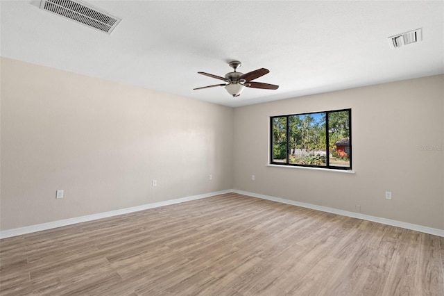 unfurnished room featuring ceiling fan and light wood-type flooring