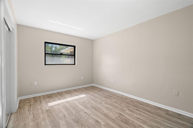 unfurnished room featuring light wood-type flooring