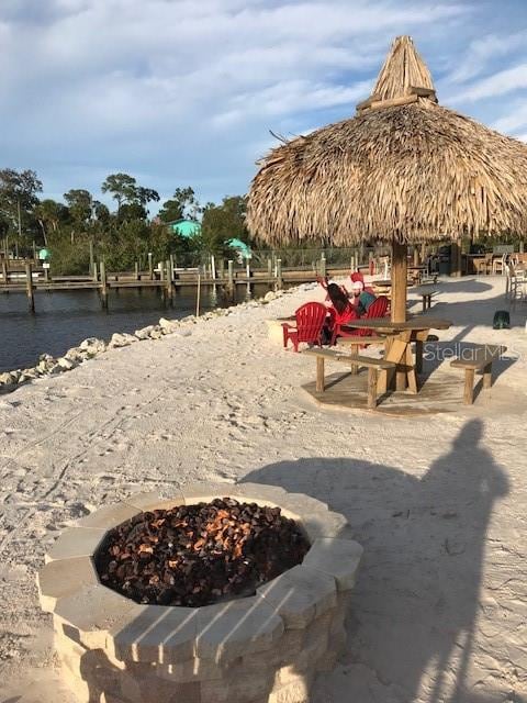 surrounding community with a gazebo and a fire pit