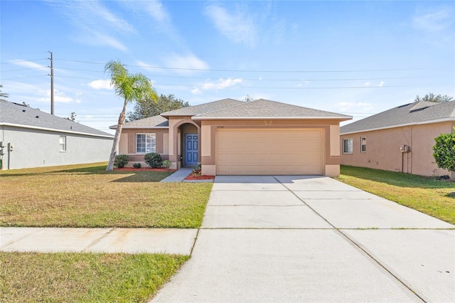 view of front of home featuring a garage and a front lawn