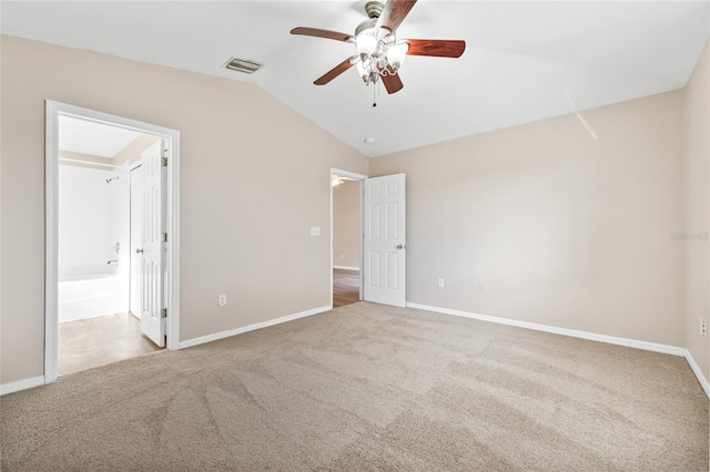 unfurnished bedroom featuring carpet floors, ceiling fan, and lofted ceiling