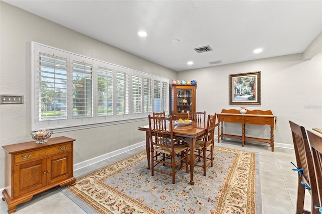 tiled dining area featuring plenty of natural light