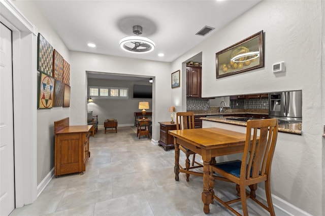 dining area featuring sink