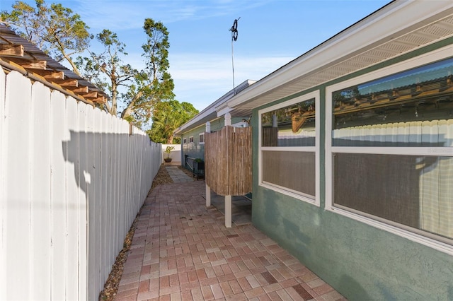 view of side of property featuring a patio