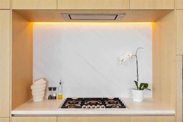 kitchen with stainless steel gas cooktop and light brown cabinets