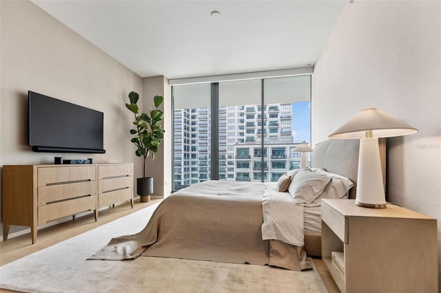 bedroom with floor to ceiling windows