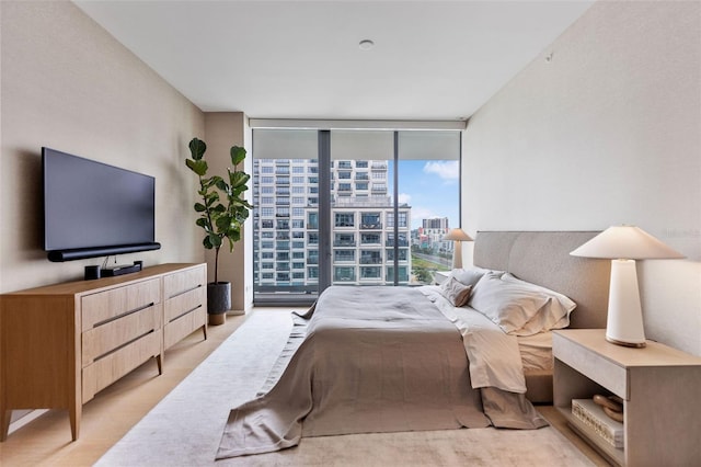 carpeted bedroom with a wall of windows