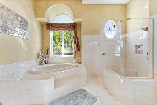 bathroom featuring separate shower and tub and tile patterned floors