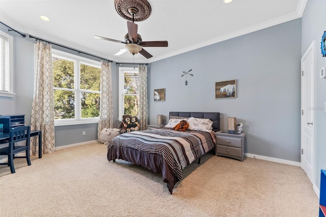 carpeted bedroom with ceiling fan and crown molding