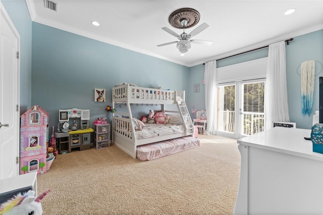 carpeted bedroom with ceiling fan and crown molding