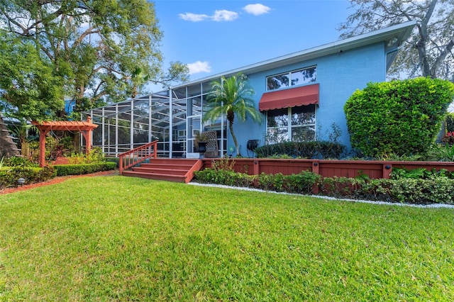 back of property featuring a lanai and a lawn