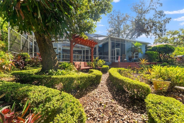 rear view of house featuring a lanai