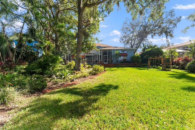 view of yard with a lanai