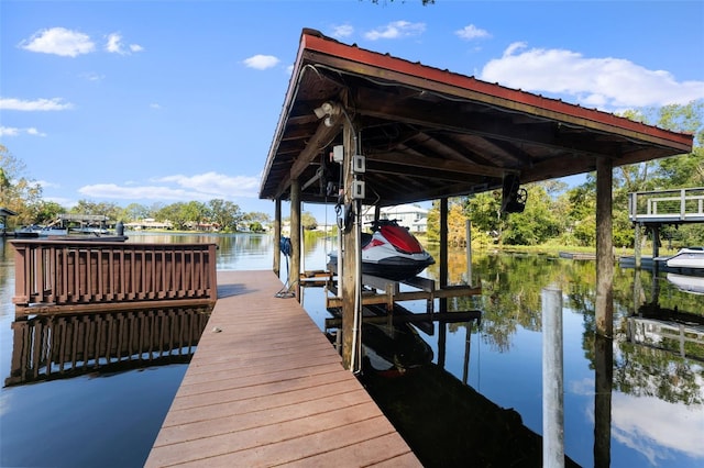 dock area with a water view